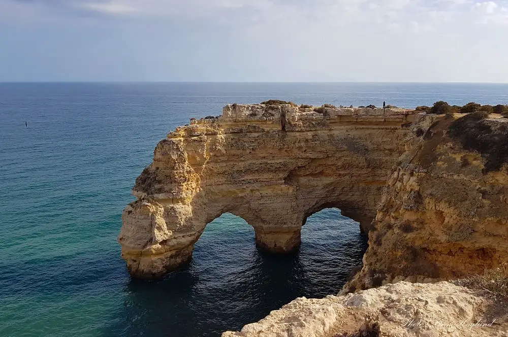 Natural arches by Marinha beach