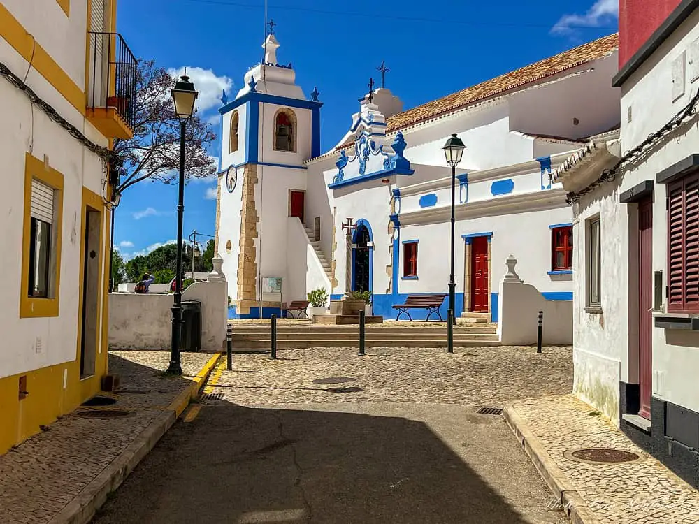 A white and blue church which is the main attraction in Alvor town.