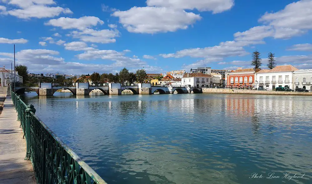 The Roman Bridge crossing the river in Tavira, the best place to stay in Algarve for couples for a laid back vacation. 