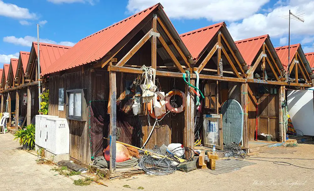 Santa Luzia fisherman's shacks of dark wood filled with fishing gadgets and gear