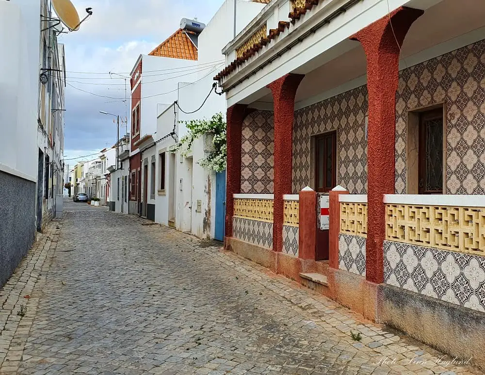 tiled houses in a street in Tavira.