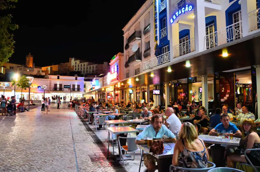 Nightlife in Albufeira old town with plenty of people in restaurants and bars - among the reasons to visit Albufeira Portugal.