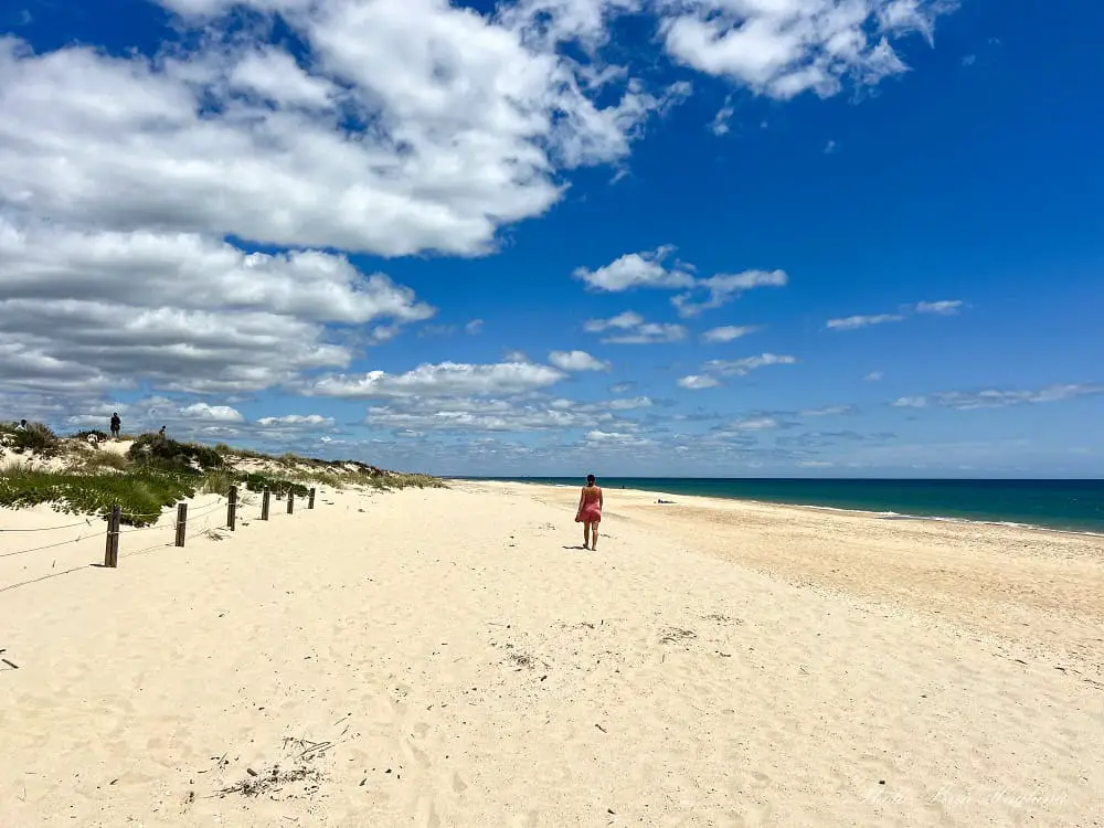 Me strolling along Barril Beach in Tavira Portugal.