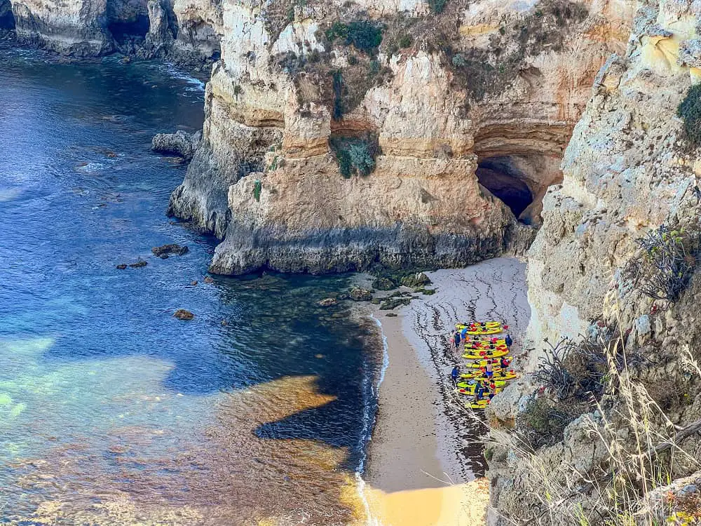 Kayaks on a beach on the way to Ponta da Piedade.