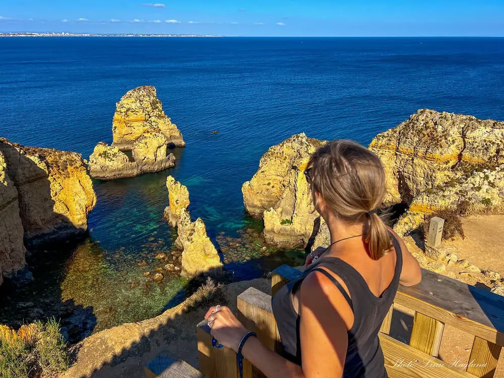 Me looking at the views from Ponta da Piedade viewpoint.